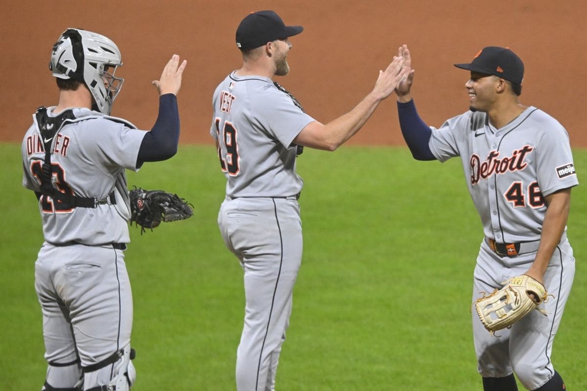 Sep 25, 2025; Cleveland, Ohio, USA; Detroit Tigers catcher Dillon Dingler (13), relief pitcher Will Vest (19) and right fielder Wenceel Perez (46) celebrate a win over the Cleveland Guardians at Progressive Field. Mandatory Credit: David Richard-Imagn Images
