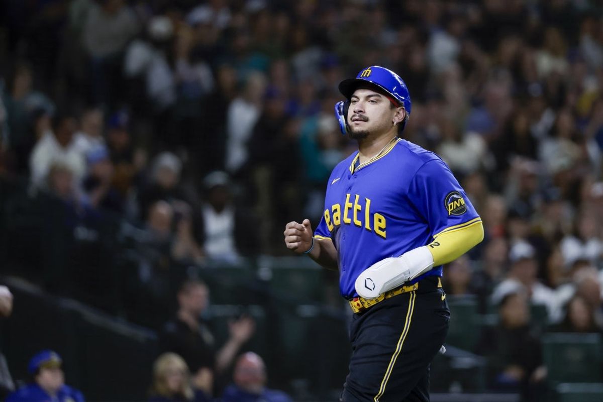 Sep 25, 2025; Seattle, Washington, USA; Seattle Mariners first baseman Josh Naylor (12) jogs to the dugout after scoring a run against the Colorado Rockies during the fourth inning at T-Mobile Park. Mandatory Credit: Joe Nicholson-Imagn Images