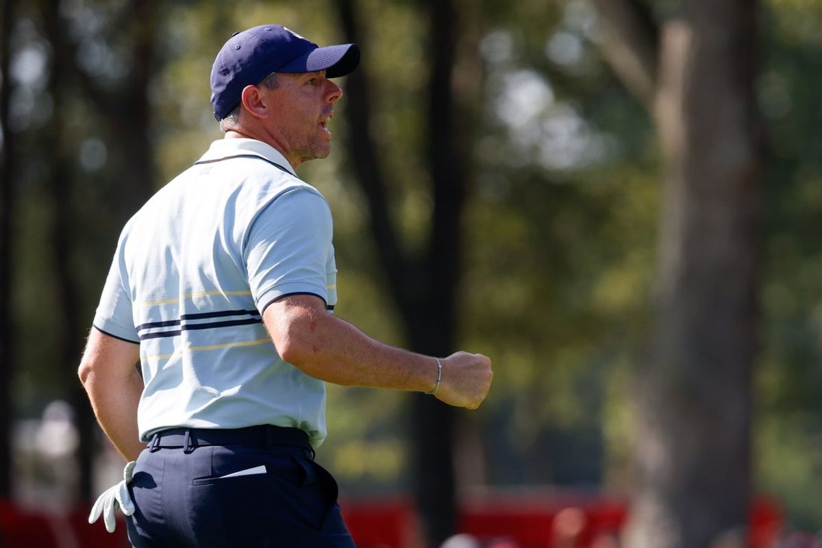 Sep 26, 2025; Bethpage, New York, USA; Team Europe golfer Rory McIlroy celebrates after his putt on the seventh green with Shane Lowry on the first day of competition for the Ryder Cup at Bethpage Black. Mandatory Credit: Peter Casey-Imagn Images
