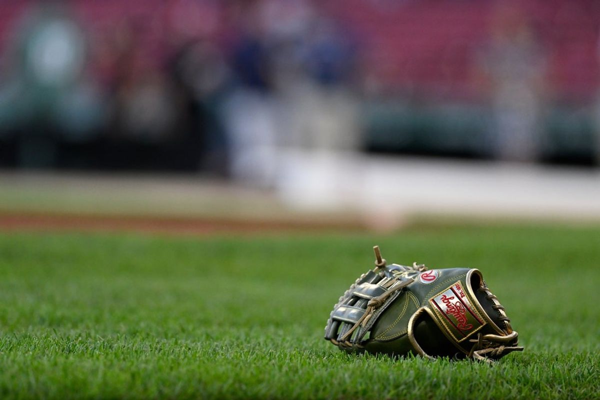 Sep 26, 2025; Boston, Massachusetts, USA; A baseball glove rests on the grass before a game between the Boston Red Sox and the Detroit Tigers at Fenway Park. Mandatory Credit: Eric Canha-Imagn Images
