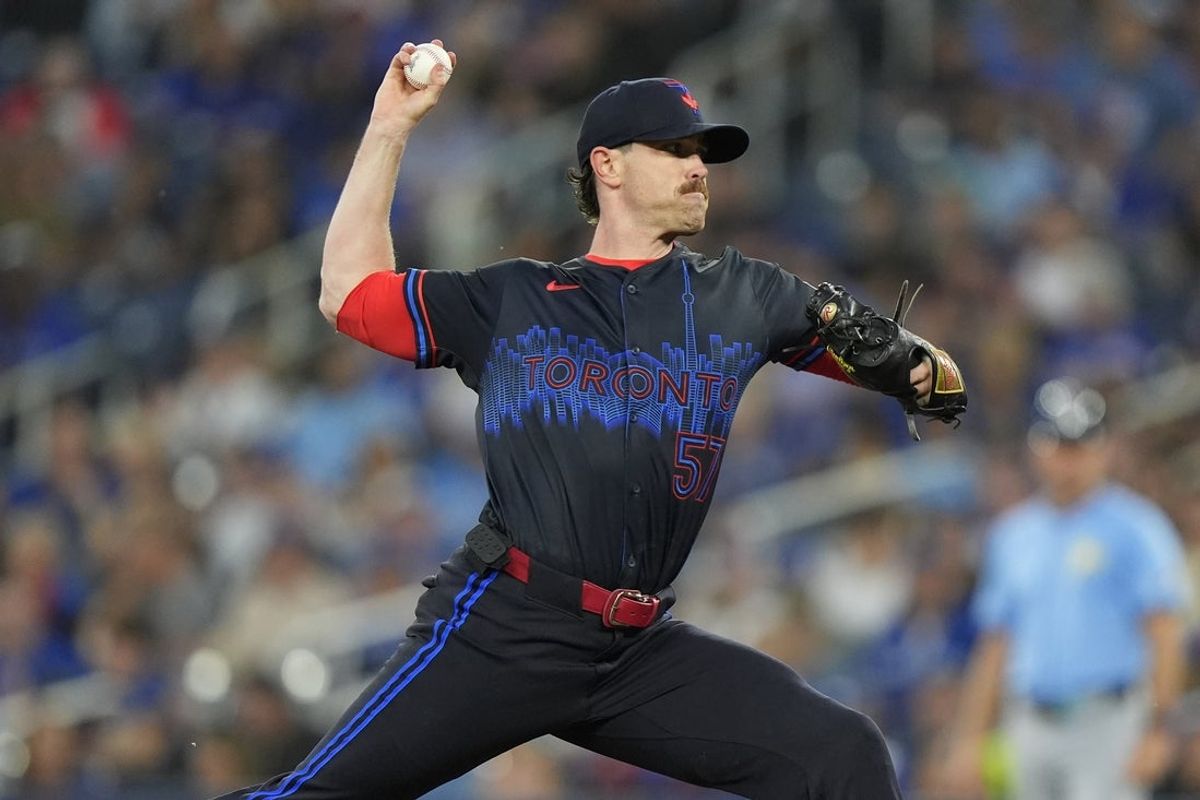 Sep 26, 2025; Toronto, Ontario, CAN; Toronto Blue Jays starting pitcher Shane Bieber (57) pitches to the Tampa Bay Rays during the first inning at Rogers Centre. Mandatory Credit: John E. Sokolowski-Imagn Images