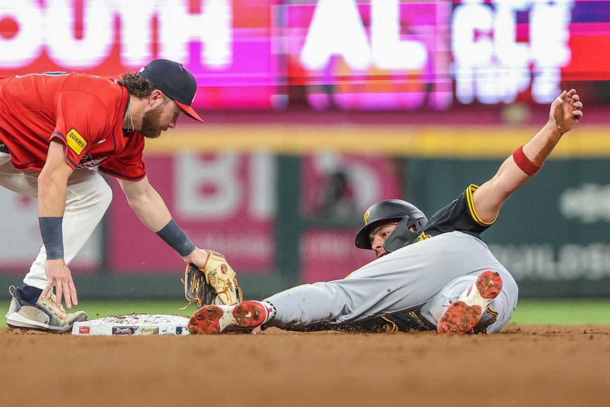 Sep 26, 2025; Cumberland, Georgia, USA; Pittsburgh Pirates second base Nick Yorke (38) steals second base against Atlanta Braves second base Brett Wisely (60) during the second inning at Truist Park. Mandatory Credit: Jordan Godfree-Imagn Images