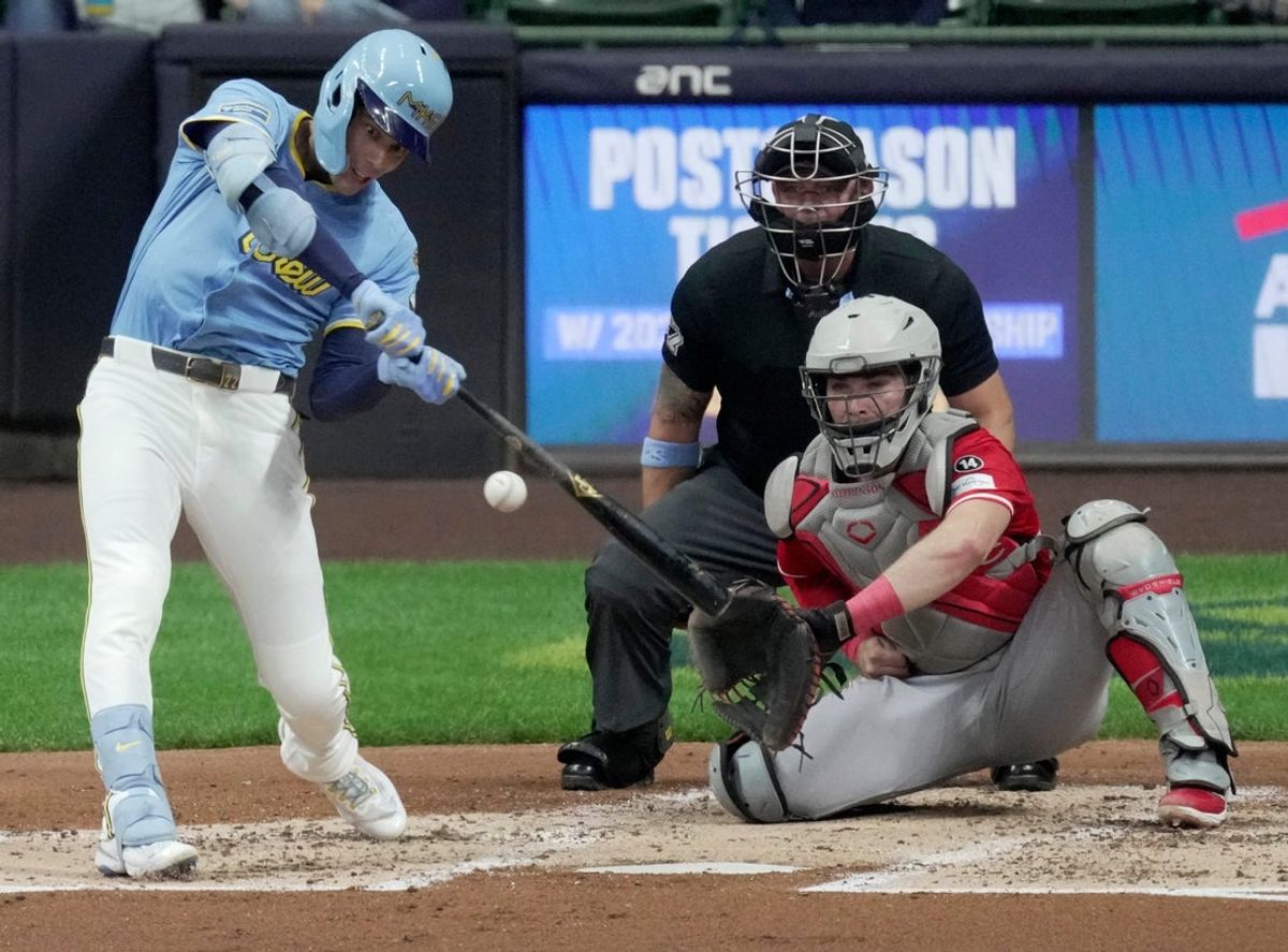 Milwaukee Brewers outfielder Christian Yelich (22) hits a double during the third inning of their game against the Cincinnati Reds Friday, September 26, 2025 at American Family Field in Milwaukee, Wisconsin.
