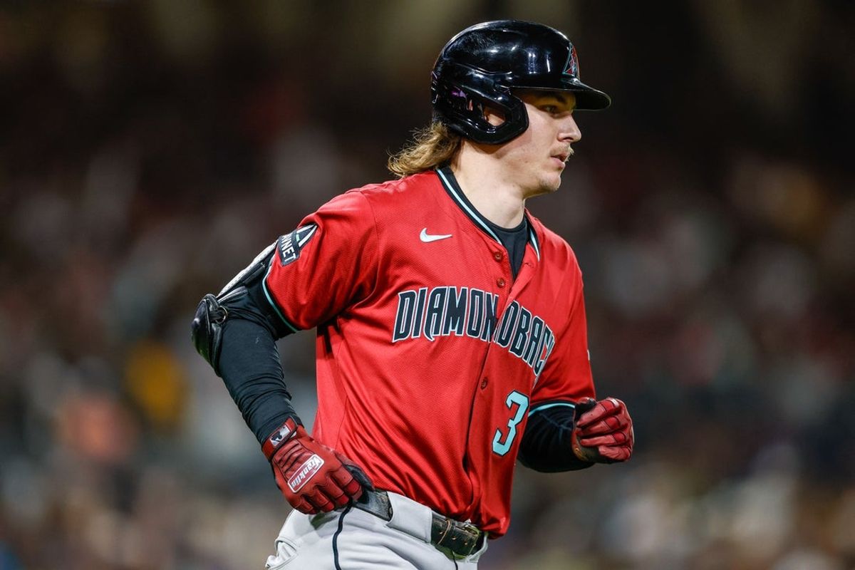Sep 26, 2025; San Diego, California, USA; Arizona Diamondbacks left fielder Jake McCarthy (31) hits a one run home run during the third inning against the San Diego Padres at Petco Park. Mandatory Credit: David Frerker-Imagn Images