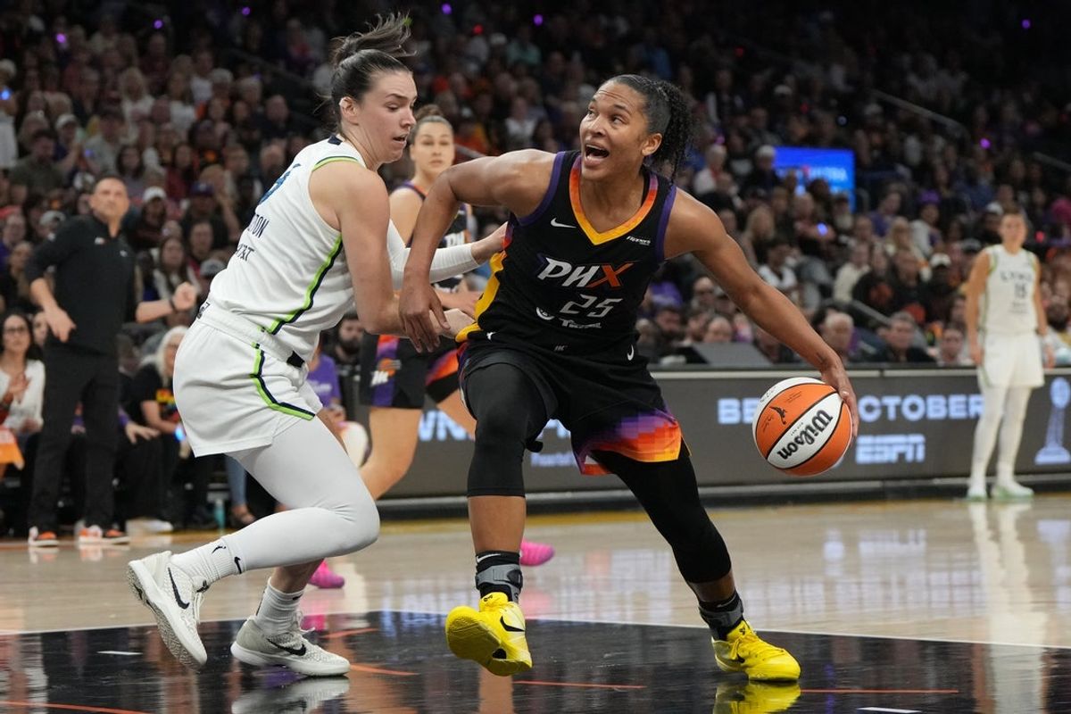 Sep 26, 2025; Phoenix, Arizona, USA; Phoenix Mercury forward Alyssa Thomas (25) drives on Minnesota Lynx forward Napheesa Collier (24) during game three of the second round for the 2025 WNBA Playoffs at PHX Arena. Mandatory Credit: Rick Scuteri-Imagn Images