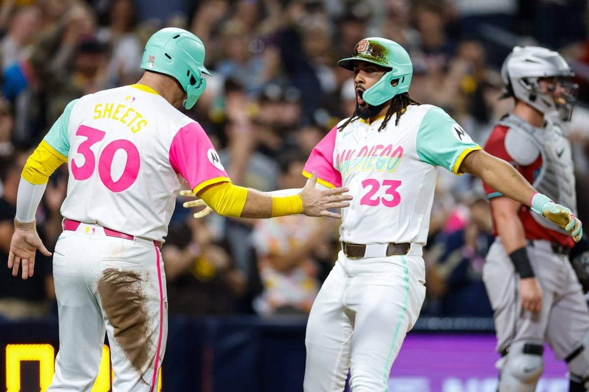 Sep 26, 2025; San Diego, California, USA; San Diego Padres right fielder Fernando Tatis Jr. (23) celebrates with left fielder Gavin Sheets (30) after hitting a grand slam home run during the fourth inning Arizona Diamondbacks at Petco Park. Mandatory Credit: David Frerker-Imagn Images