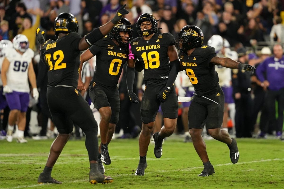Sep 26, 2025; Tempe, Arizona, USA; Arizona State Sun Devils linebacker Martell Hughes (18) celebrates a game-winning interception with defensive lineman Prince Dorbah (32), defensive back Rodney Bimage Jr. (0) and linebacker Jordan Crook (8) against TCU Horned Frogs in the second half at Mountain America Stadium, Home of the ASU Sun Devils. Mandatory Credit: Jacob Reiner-Imagn Images