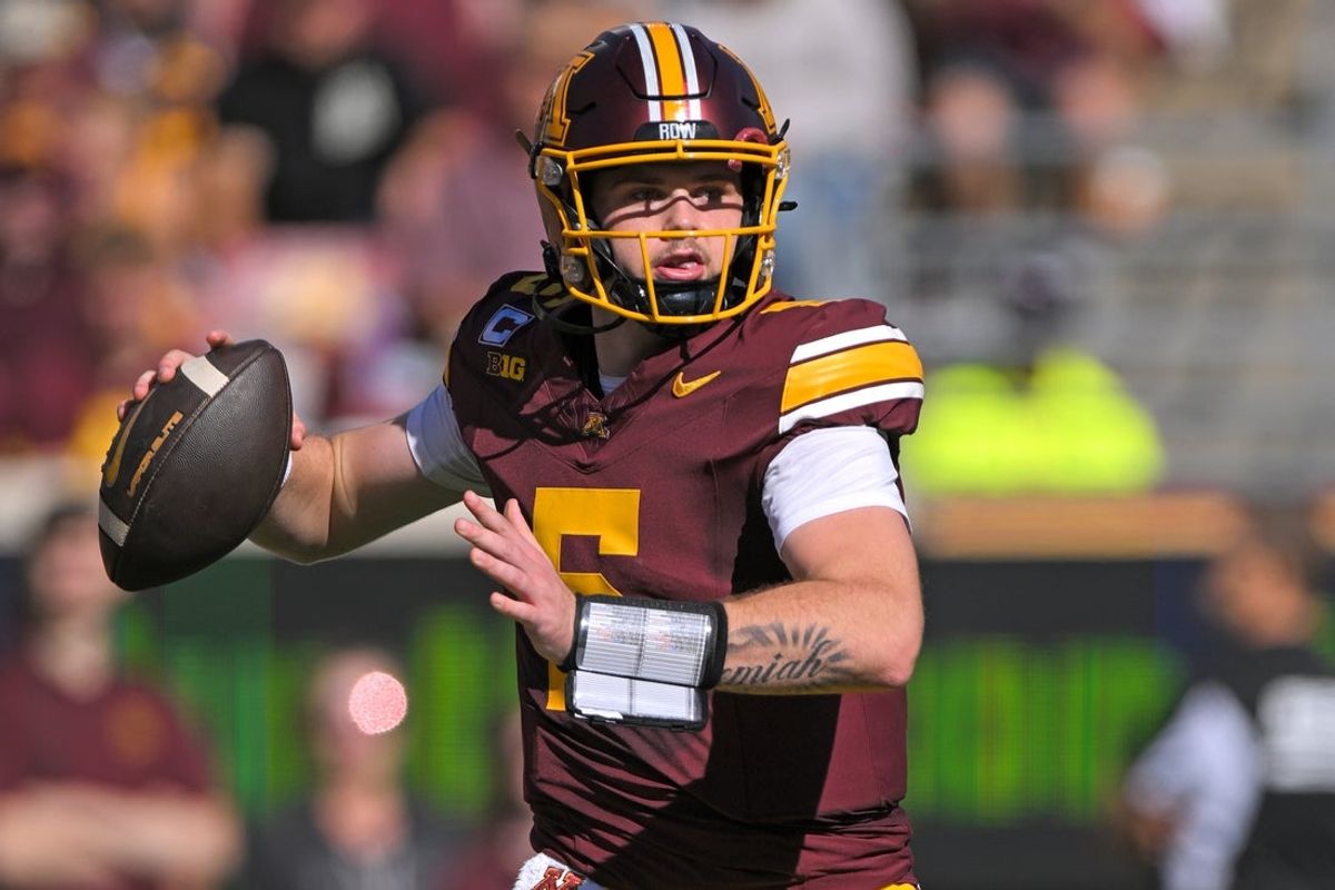 Sep 27, 2025; Minneapolis, Minnesota, USA;  Minnesota Golden Gophers quarterback Drake Lindsey (5) makes a pass against Rutgers Scarlet Knights during the first quarter at Huntington Bank Stadium. Mandatory Credit: Nick Wosika-Imagn Images
