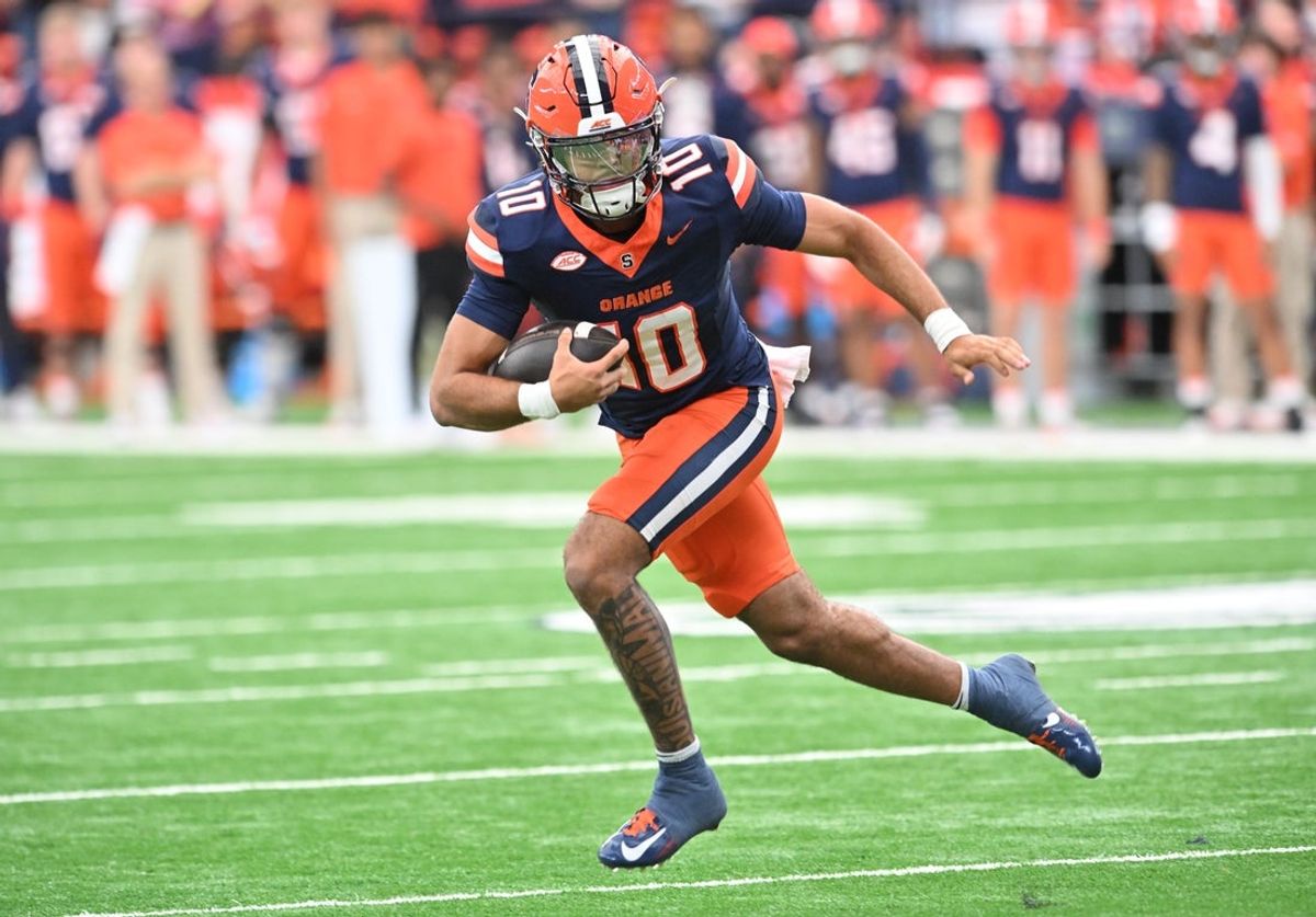 Sep 27, 2025; Syracuse, New York, USA; Syracuse Orange quarterback Rickie Collins (10) runs out of the pocket in the first quarter against the Duke Blue Devils at the JMA Wireless Dome. Mandatory Credit: Mark Konezny-Imagn Images