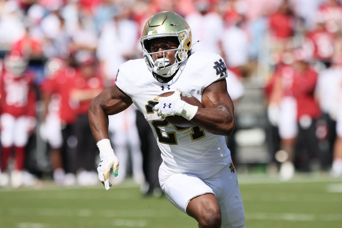 Sep 27, 2025; Fayetteville, Arkansas, USA; Notre Dame Fighting Irish running back Jadarian Price (24) rushes during the first quarter against the Arkansas Razorbacks at Donald W. Reynolds Razorback Stadium. Mandatory Credit: Nelson Chenault-Imagn Images
