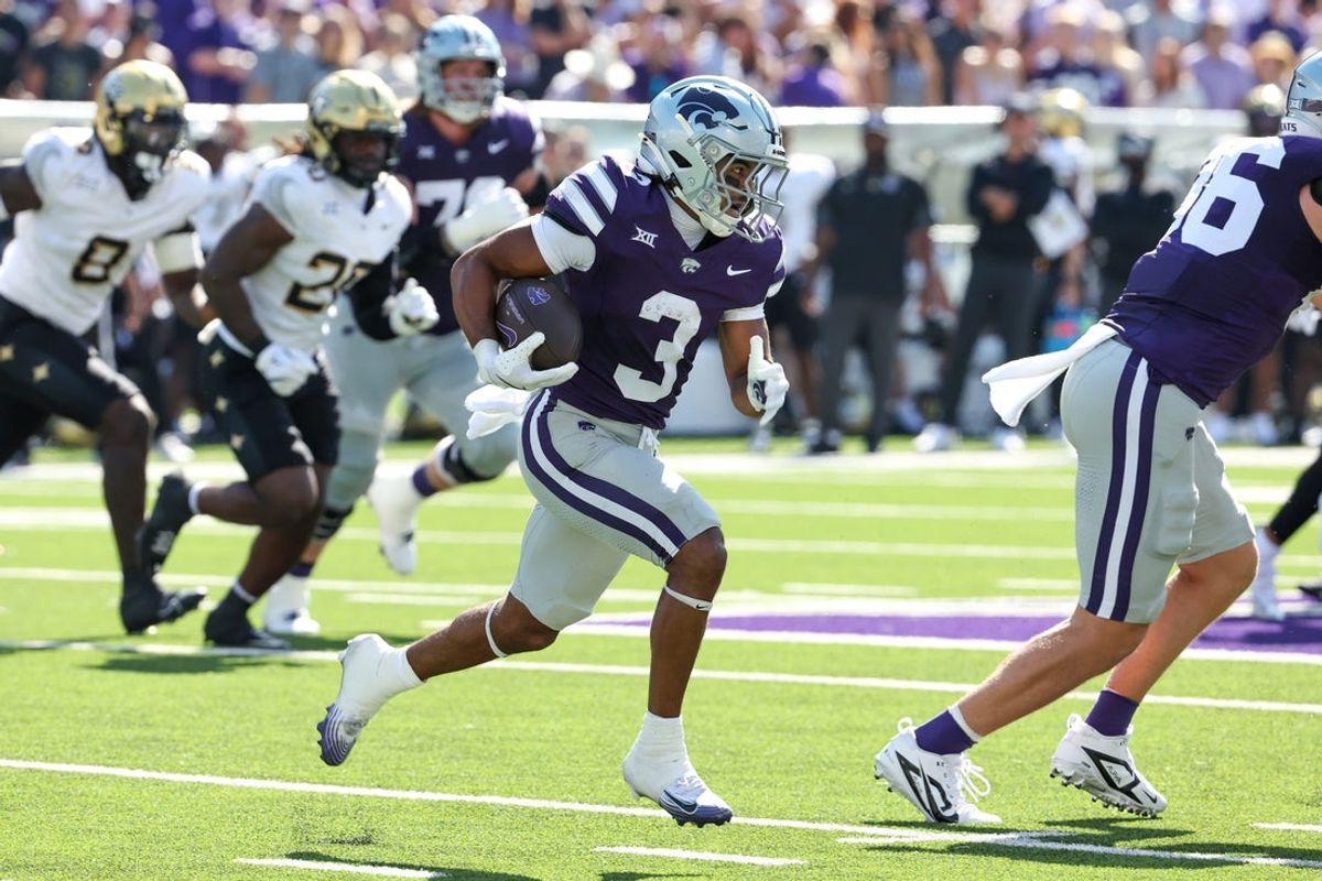 Sep 27, 2025; Manhattan, Kansas, USA; Kansas State Wildcats running back Dylan Edwards (3) carries the ball during the first quarter against the UCF Knights at Bill Snyder Family Football Stadium. Mandatory Credit: Scott Sewell-Imagn Images