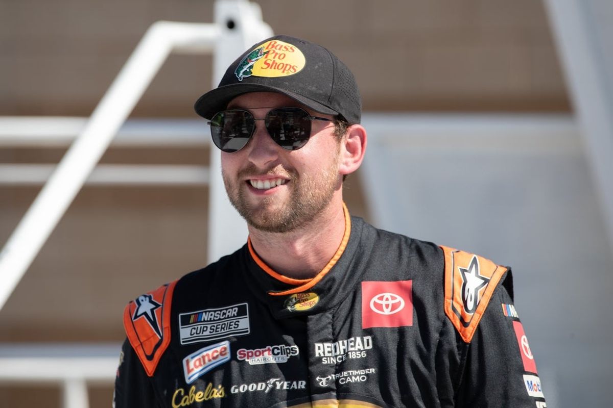 Sep 27, 2025; Kansas City, Kansas, USA;  Chase Briscoe celebrates winning the starting pole position for the NASCAR Cup Series race at Kansas Speedway. Mandatory Credit: Kylie Graham-Imagn Images