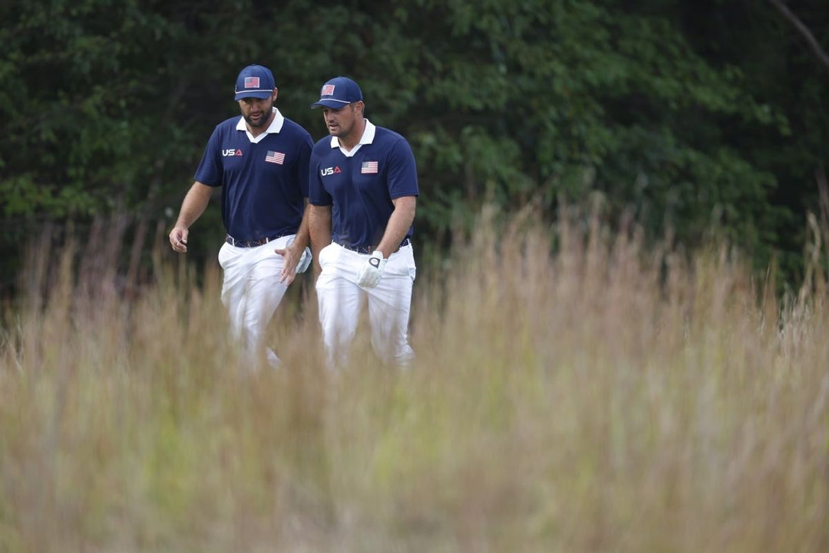 Sep 27, 2025; Bethpage, New York, USA; Team USA golfer Scottie Scheffler and golfer Bryson DeChambeau on the 11th hole on the penultimate day of competition for the Ryder Cup at Bethpage Black. Mandatory Credit: Peter Casey-Imagn Images