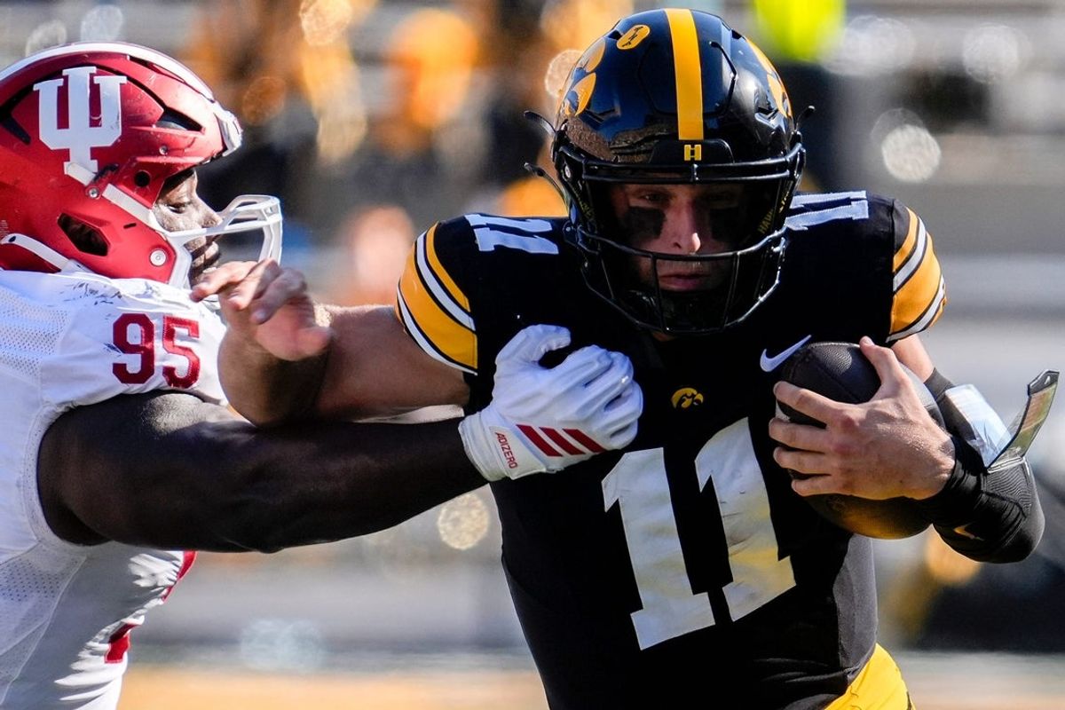 Iowa Hawkeyes quarterback Mark Gronowski (11) runs the ball against the Indiana Hoosiers Sept. 27, 2025 at Kinnick Stadium in Iowa City, Iowa.