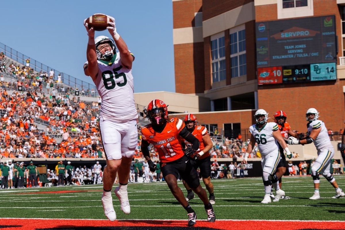Sep 27, 2025; Stillwater, Oklahoma, USA; Baylor Bears tight end Matthew Klopfenstein (85) makes a reception in the end zone for a touchdown during the first half against the Oklahoma State Cowboys at Boone Pickens Stadium. Mandatory Credit: William Purnell-Imagn Images