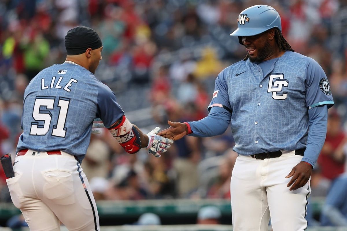 Sep 27, 2025; Washington, District of Columbia, USA; Washington Nationals outfielder Daylen Lile (51) celebrates with Nationals first baseman Josh Bell (19) after hitting a two run home run against the Chicago White Sox during the fourth inning at Nationals Park. Mandatory Credit: Geoff Burke-Imagn Images