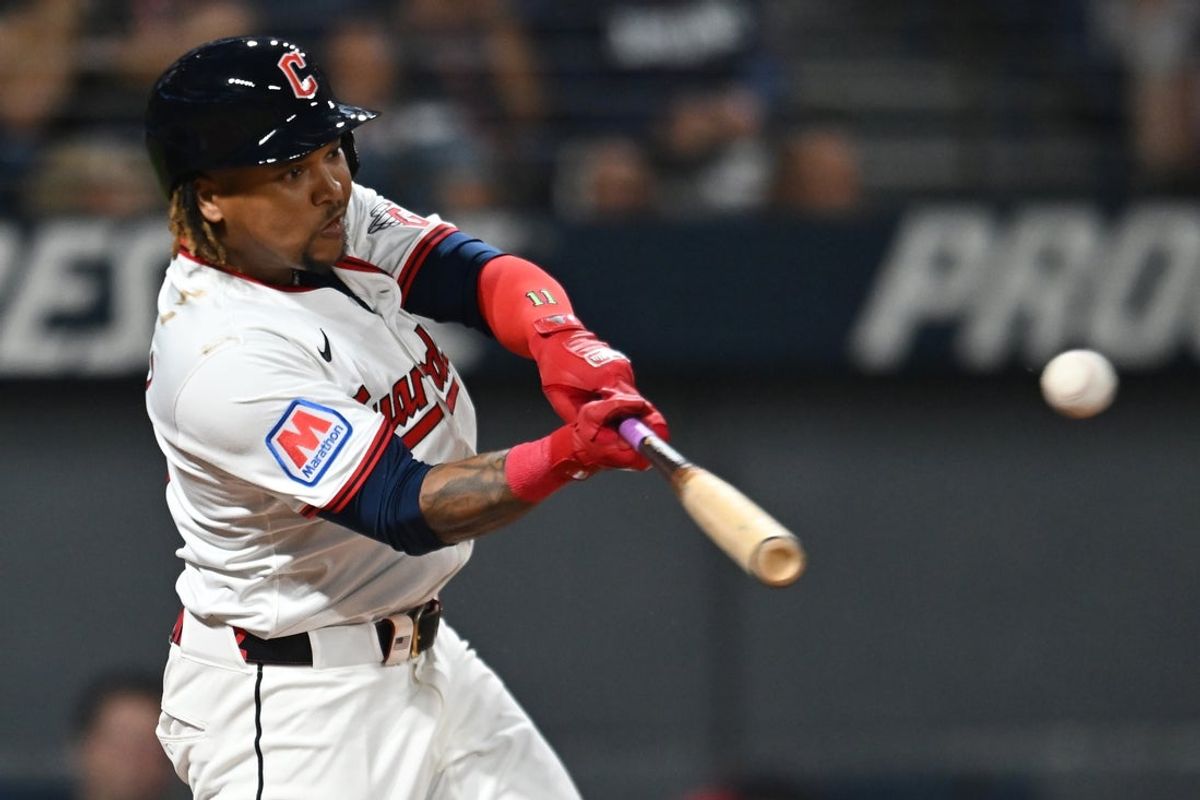 Sep 27, 2025; Cleveland, Ohio, USA; Cleveland Guardians third baseman Jose Ramirez (11) hits a single against the Texas Rangers during the first inning at Progressive Field. Mandatory Credit: Ken Blaze-Imagn Images