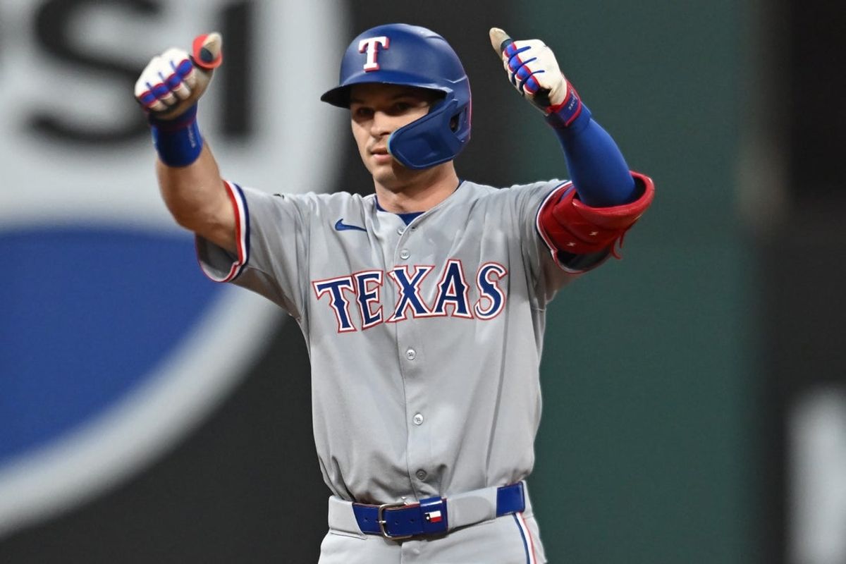 Sep 27, 2025; Cleveland, Ohio, USA; Texas Rangers third baseman Josh Jung (6) celebrates after hitting an RBI double during the first inning against the Cleveland Guardians at Progressive Field. Mandatory Credit: Ken Blaze-Imagn Images