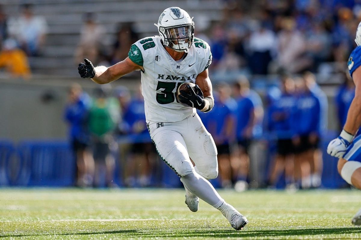 Sep 27, 2025; Colorado Springs, Colorado, USA; Hawaii Rainbow Warriors running back Landon Sims (30) runs the ball in the fourth quarter against the Air Force Falcons at Falcon Stadium. Mandatory Credit: Isaiah J. Downing-Imagn Images