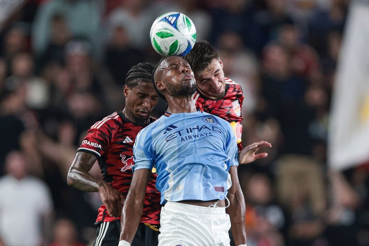 Sep 27, 2025; Harrison, New Jersey, USA; New York City FC midfielder Andres Perea (8) battles for the ball against New York Red Bulls defender Noah Eile (3) an ddefender Kyle Duncan (6) during the first half at Sports Illustrated Stadium. Mandatory Credit: Vincent Carchietta-Imagn Images