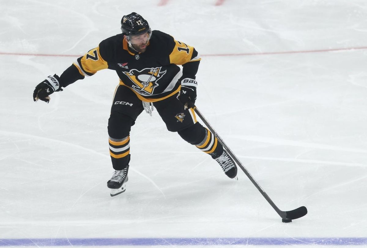 Sep 27, 2025; Pittsburgh, Pennsylvania, USA;  Pittsburgh Penguins right wing Bryan Rust (17) skates up ice with the puck against the Columbus Blue Jackets during the second period at PPG Paints Arena. Mandatory Credit: Charles LeClaire-Imagn Images