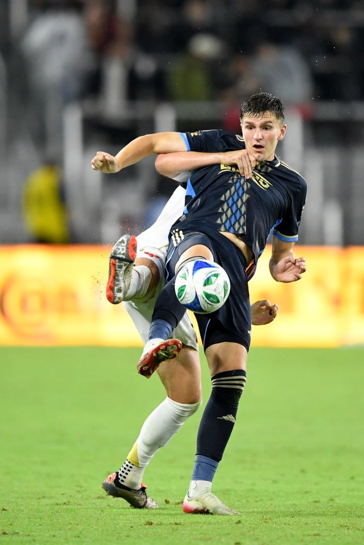 Sep 27, 2025; Washington, District of Columbia, USA; Philadelphia Union forward Mikael Uhre (7) kicks the ball against D.C. United during the second half at Audi Field. Mandatory Credit: Hannah Foslien-Imagn Images