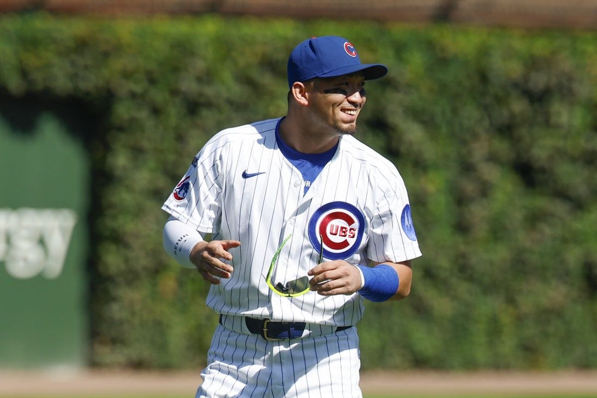 Sep 27, 2025; Chicago, Illinois, USA; Chicago Cubs right fielder Seiya Suzuki (27) warms up before a baseball game against the St. Louis Cardinals at Wrigley Field. Mandatory Credit: Kamil Krzaczynski-Imagn Images