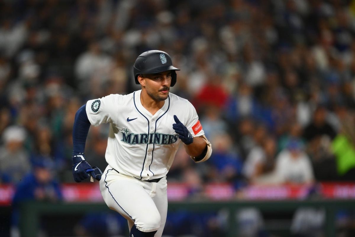 Sep 27, 2025; Seattle, Washington, USA; Seattle Mariners catcher Harry Ford (5) runs towards first base after hitting a single against the Los Angeles Dodgers during the second inning at T-Mobile Park. Mandatory Credit: Steven Bisig-Imagn Images