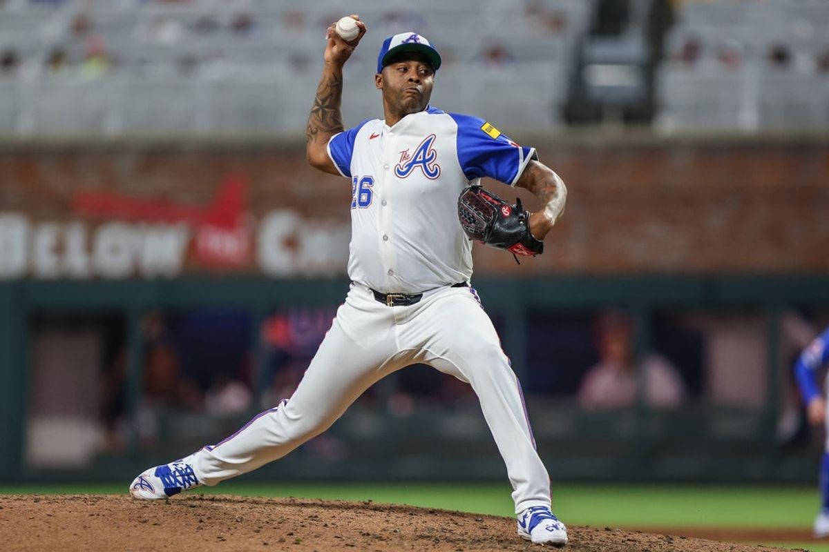 Sep 27, 2025; Cumberland, Georgia, USA; Atlanta Braves pitcher Raisel Iglesias (26) pitches the ball against the Pittsburgh Pirates during the ninth inning at Truist Park. Mandatory Credit: Jordan Godfree-Imagn Images