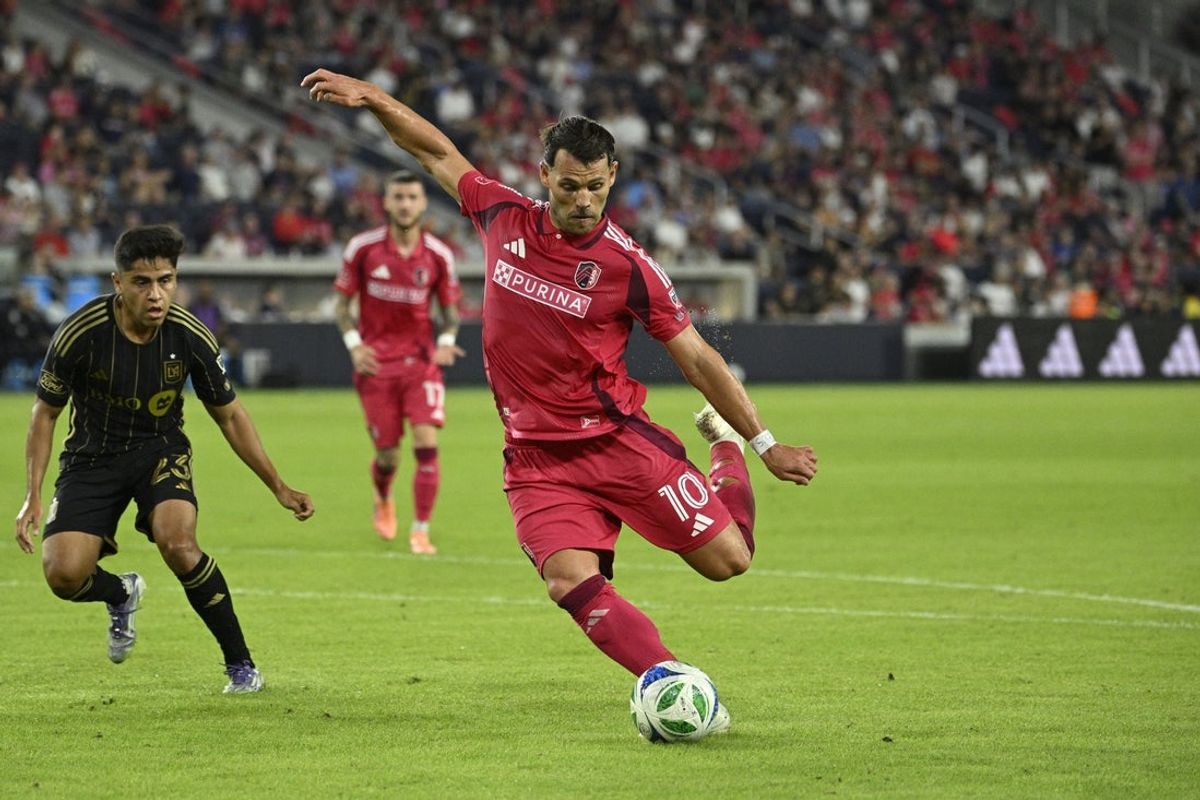 Sep 27, 2025; St. Louis, Missouri, USA; St. Louis CITY SC midfielder Eduard Lowen (10) takes a shot against LAFC in the second half at Energizer Park. Mandatory Credit: Joe Puetz-Imagn Images