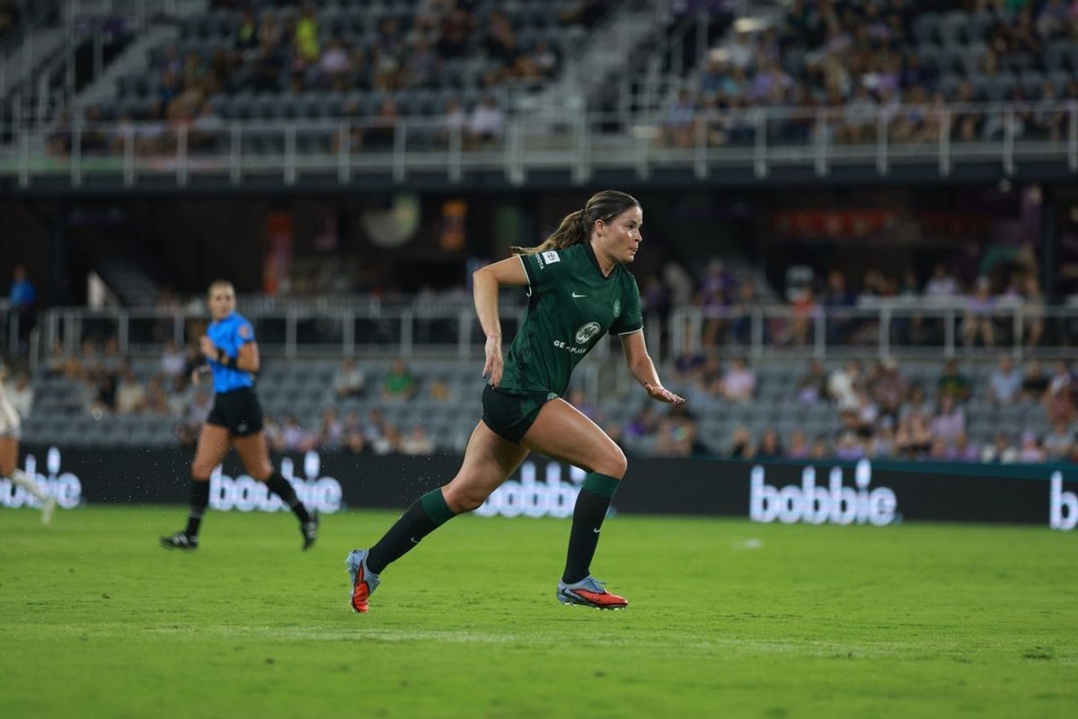 Sep 27, 2025; Louisville, Kentucky, USA;  Racing Louisville FC forward Emma Sears (13) runs on the field during the first half against Angel City FC at Lynn Family Stadium. Mandatory Credit: EM Dash-Imagn Images