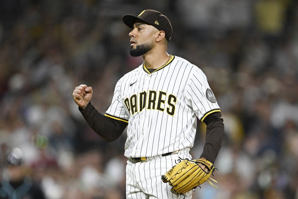 Sep 27, 2025; San Diego, California, USA; San Diego Padres relief pitcher Robert Suarez (75) pumps his fist after the Padres beat the Arizona Diamondbacks at Petco Park. Mandatory Credit: Denis Poroy-Imagn Images
