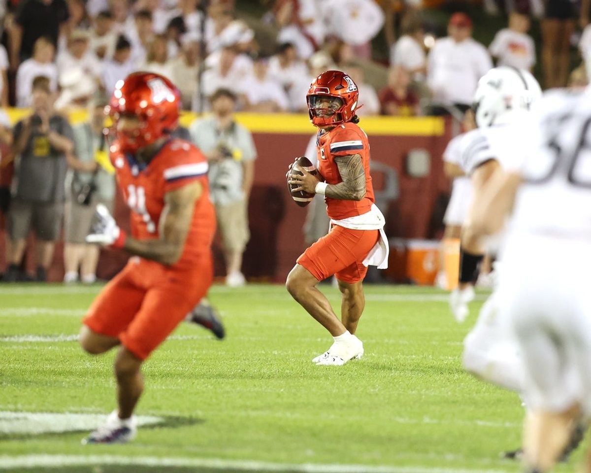 Sep 27, 2025; Ames, Iowa, USA; Arizona Wildcats quarterback Noah Fifita (1) looks to throw against the Iowa State Cyclones during the second half at Jack Trice Stadium. Mandatory Credit: Reese Strickland-Imagn Images