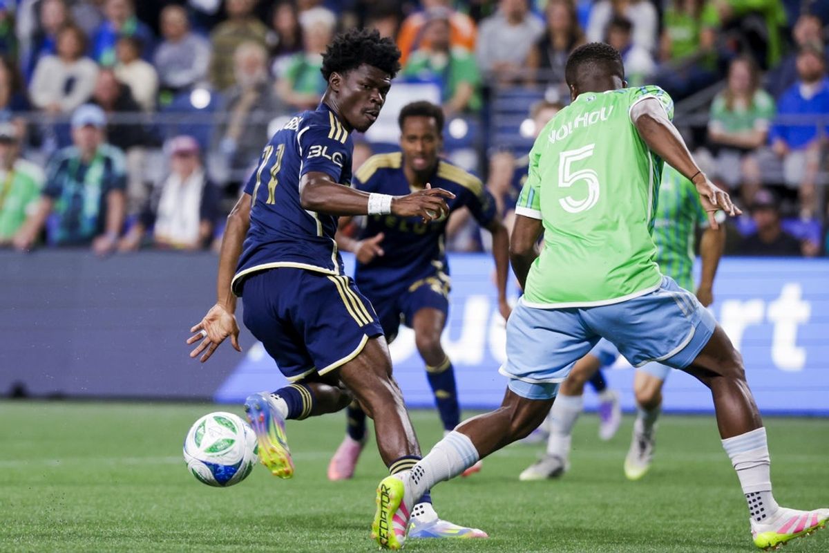 Sep 27, 2025; Seattle, Washington, USA; Vancouver Whitecaps forward Emmanuel Sabbi (11) heel passes against the Seattle Sounders FC during the first half at Lumen Field. Mandatory Credit: Joe Nicholson-Imagn Images