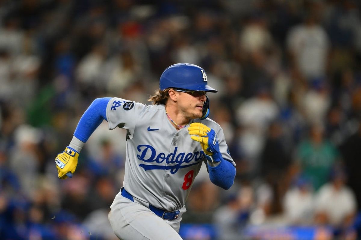 Sep 27, 2025; Seattle, Washington, USA; Los Angeles Dodgers third baseman Enrique Hernandez (8) runs towards first base after hitting a 2-RBI double against the Seattle Mariners during the ninth inning at T-Mobile Park. Mandatory Credit: Steven Bisig-Imagn Images
