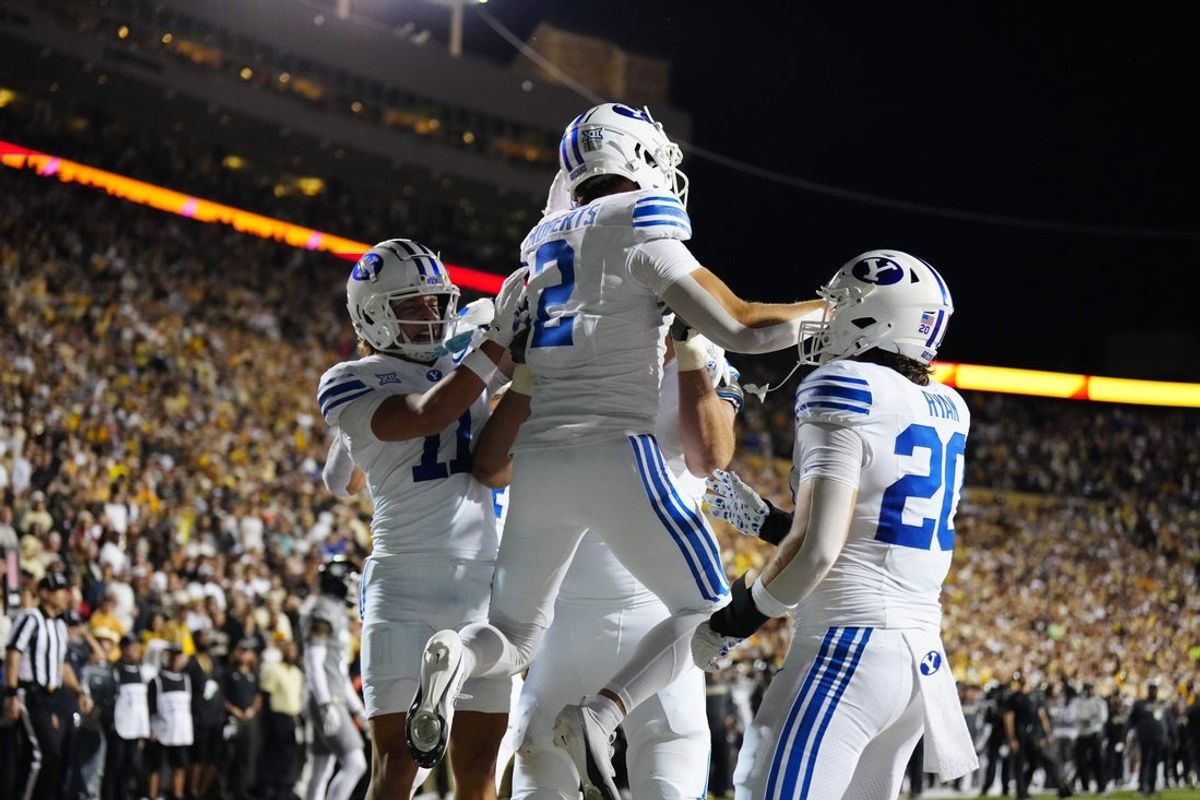 Sep 27, 2025; Boulder, Colorado, USA; Brigham Young Cougars wide receiver Chase Roberts (2) celebrates his touchdown reception in the third quarter against the Colorado Buffaloes at Folsom Field. Mandatory Credit: Ron Chenoy-Imagn Images