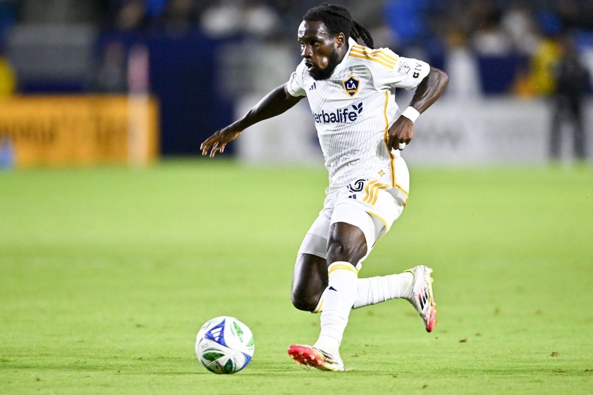 Sep 27, 2025; Carson, California, USA; LA Galaxy forward Joseph Paintsil (28) moves the ball down the field against Sporting Kansas City during the second half at Dignity Health Sports Park. Mandatory Credit: Kelvin Kuo-Imagn Images