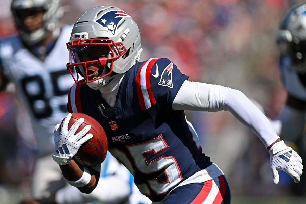 Sep 28, 2025; Foxborough, Massachusetts, USA; New England Patriots cornerback Marcus Jones (25) returns a punt for a touchdown against the Carolina Panthers during the first half at Gillette Stadium. Mandatory Credit: Brian Fluharty-Imagn Images