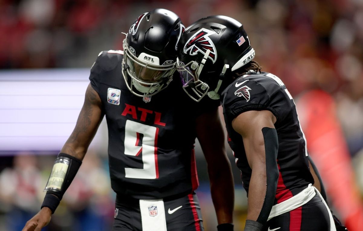 Sep 28, 2025; Atlanta, Georgia, USA; Atlanta Falcons running back Bijan Robinson (7) celebrates with quarterback Michael Penix Jr. (9) after scoring a touchdown during the first half against the Washington Commanders at Mercedes-Benz Stadium. Mandatory Credit: Brett Davis-Imagn Images