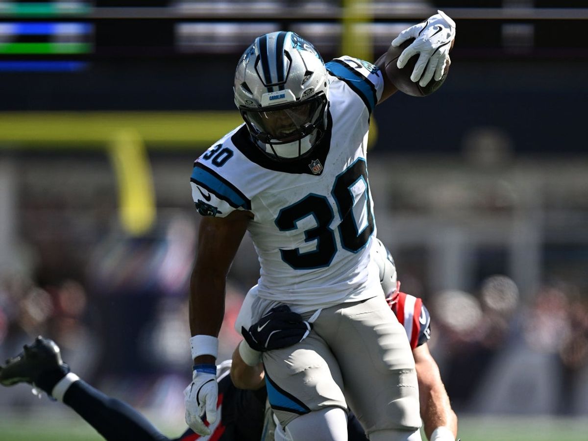 Sep 28, 2025; Foxborough, Massachusetts, USA; Carolina Panthers running back Chuba Hubbard (30) runs against the New England Patriots during the first half at Gillette Stadium. Mandatory Credit: Brian Fluharty-Imagn Images