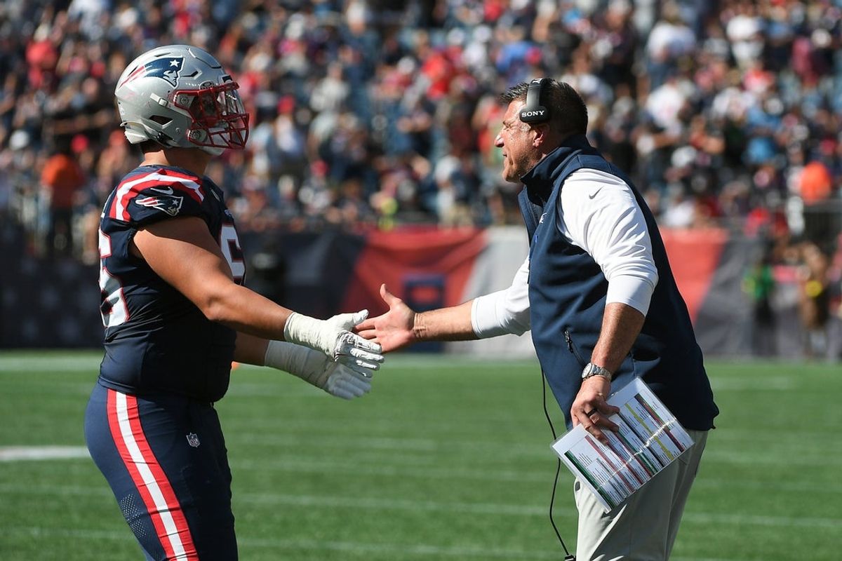 Sep 28, 2025; Foxborough, Massachusetts, USA; New England Patriots head coach Mike Vrable congratulates offensive tackle Will Campbell (66) after a touchdown during the first half against the Carolina Panthers at Gillette Stadium. Mandatory Credit: Bob DeChiara-Imagn Images