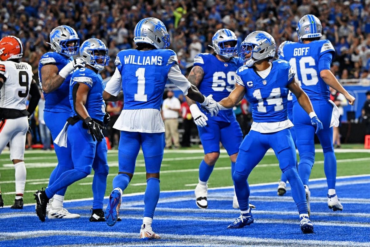 Sep 28, 2025; Detroit, Michigan, USA; Detroit Lions wide receiver Amon-Ra St. Brown (14) celebrates after catching a touchdown pass during the first half against the Cleveland Browns at Ford Field. Mandatory Credit: Lon Horwedel-Imagn Images
