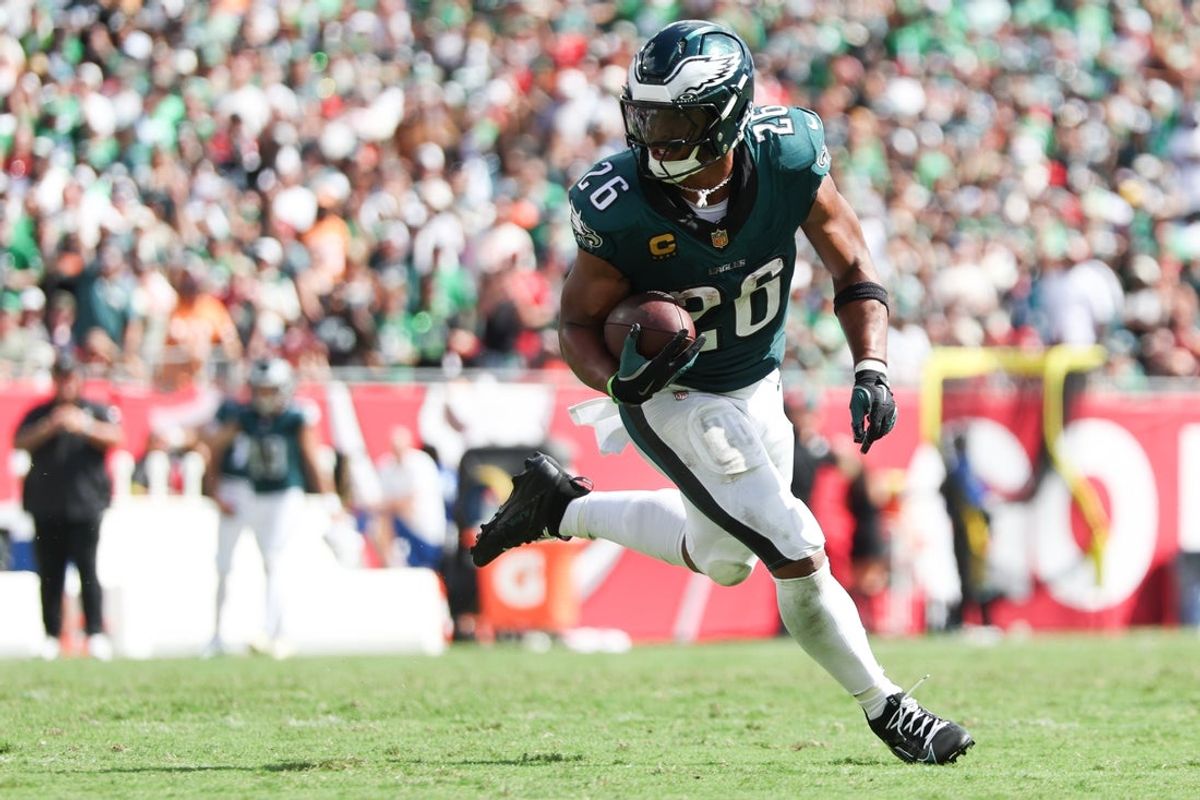 Sep 28, 2025; Tampa, Florida, USA; Philadelphia Eagles running back Saquon Barkley (26) runs with the ball during the third quarter against the Tampa Bay Buccaneers at Raymond James Stadium. Mandatory Credit: Nathan Ray Seebeck-Imagn Images