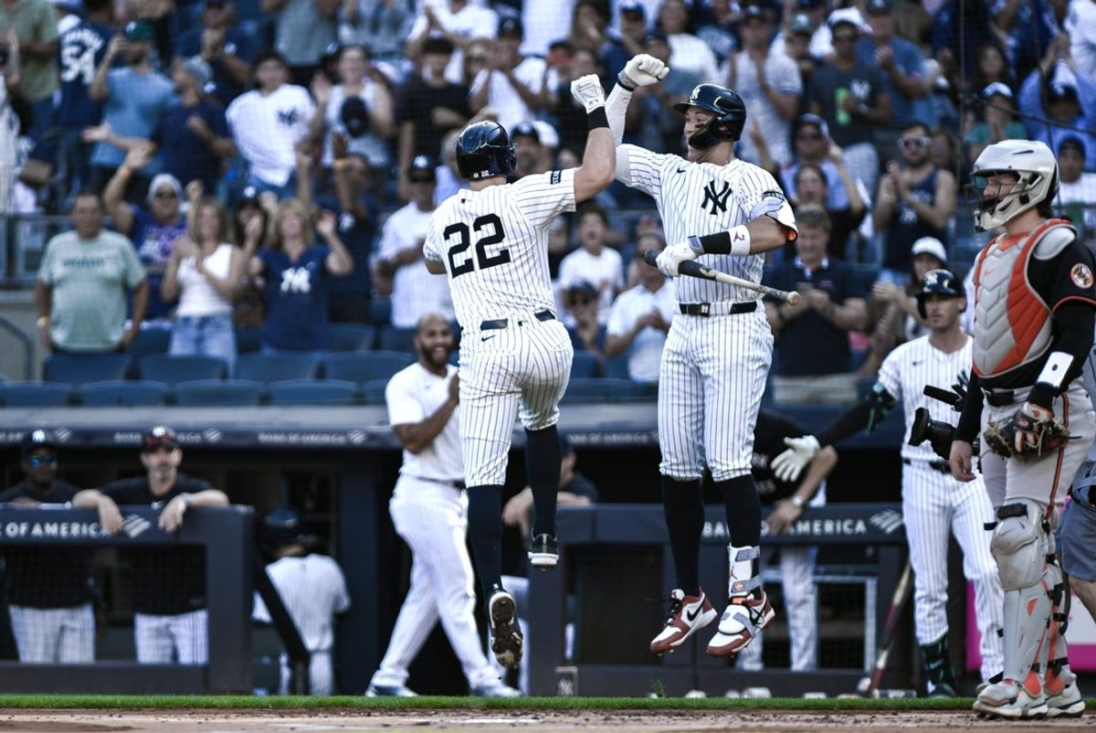 Sep 28, 2025; Bronx, New York, USA; New York Yankees first baseman Ben Rice (22) celebrates at home plate with outfielder Aaron Judge (99) after hitting a solo home run against the Baltimore Orioles during the first inning at Yankee Stadium. Mandatory Credit: John Jones-Imagn Images