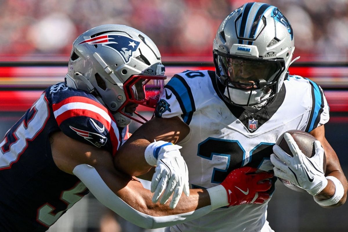 Sep 28, 2025; Foxborough, Massachusetts, USA; New England Patriots linebacker Christian Elliss (53) tackles Carolina Panthers running back Chuba Hubbard (30) during the second half at Gillette Stadium. Mandatory Credit: Brian Fluharty-Imagn Images