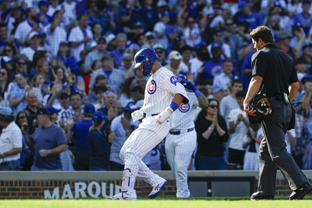 Sep 28, 2025; Chicago, Illinois, USA; Chicago Cubs right fielder Seiya Suzuki (27) crosses home plate after hitting a solo home run against the St. Louis Cardinals during the fifth inning at Wrigley Field. Mandatory Credit: Kamil Krzaczynski-Imagn Images