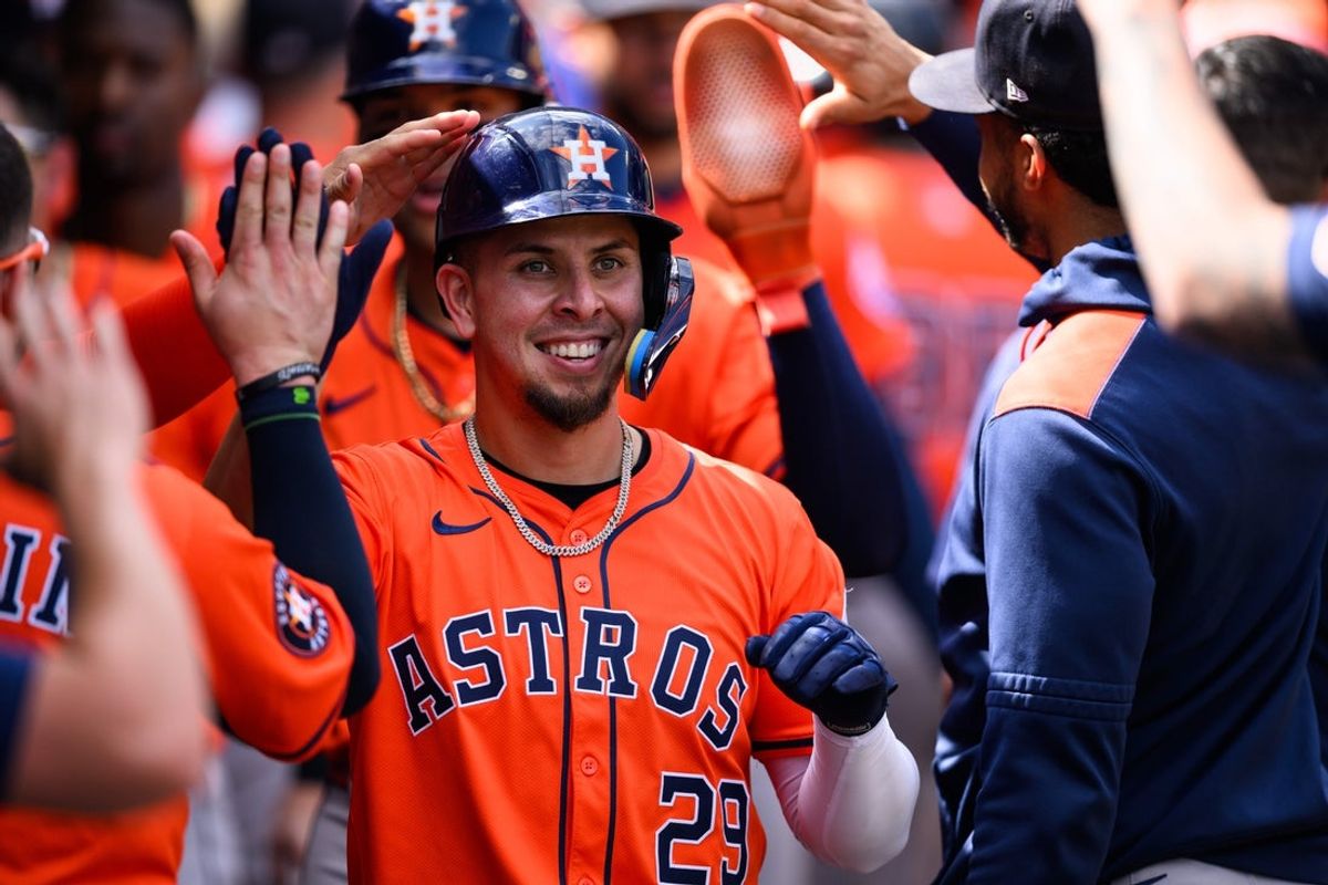Sep 28, 2025; Anaheim, California, USA; Houston Astros third baseman Ramon Urias (29) is greeted by teammates after hitting a home run during the fifth inning against the Los Angeles Angels at Angel Stadium. Mandatory Credit: William Liang-Imagn Images