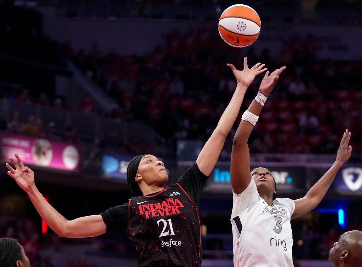 Indiana Fever forward Makayla Timpson (21) and Las Vegas Aces forward NaLyssa Smith (3) battle for control of the ball during Game 4 of the WNBA semifinals on Sunday, Sept. 28, 2025, at Gainbridge Fieldhouse in Indianapolis. The Fever defeated the Aces 90-83.