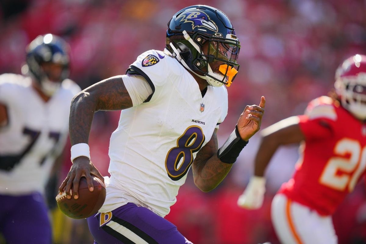 Sep 28, 2025; Kansas City, Missouri, USA;  Baltimore Ravens quarterback Lamar Jackson (8) scrambles during the first half against the Kansas City Chiefs at GEHA Field at Arrowhead Stadium. Mandatory Credit: Jay Biggerstaff-Imagn Images