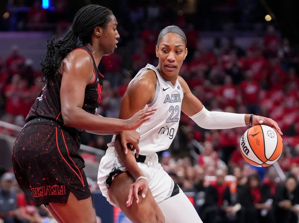 Indiana Fever forward Aliyah Boston (7) defends Las Vegas Aces center A'ja Wilson (22) during Game 4 of the WNBA semifinals on Sunday, Sept. 28, 2025, at Gainbridge Fieldhouse in Indianapolis.